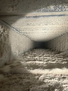 Cobwebs and dust inside metal HVAC duct