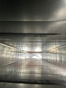 Reflective silver duct tunnel after professional cleaning